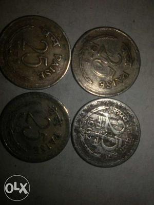 Four 25 Paise Coins