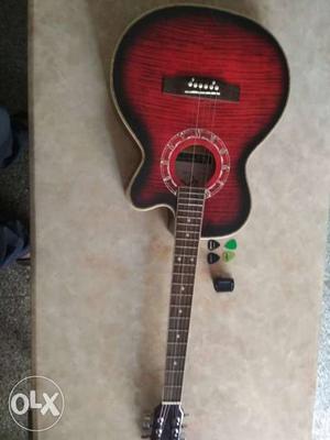 Guitar along with cover tuner and four pics. In brand new