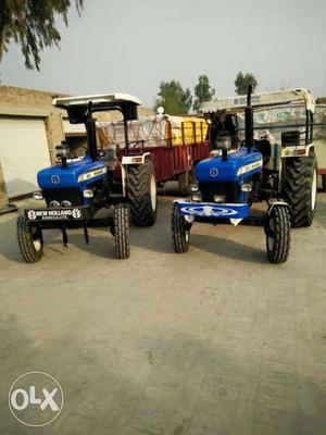 Two Blue Tractors