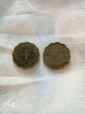 Two Scalloped Copper-colored Coins