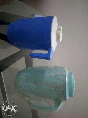 Two Teal And Blue Plastic Pitchers