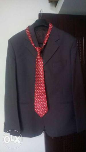 Black Suit Jacket And Red Necktie