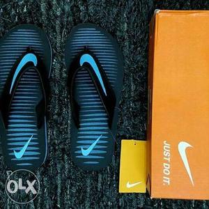 Blue-and-black Nike Flip-flops With Orange Box