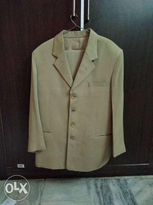 Brand new suit light brown colour size 36 cloth