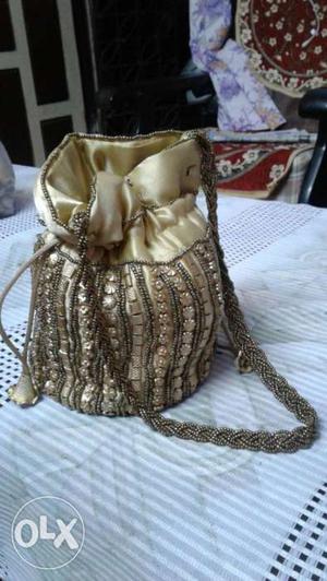 Designer batwa style full work purse in low