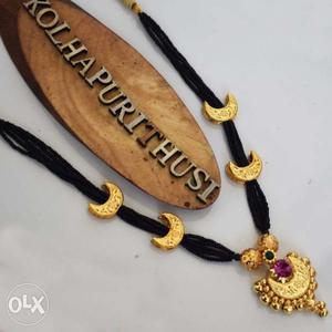 Gold-colored And Black Pendant Necklace