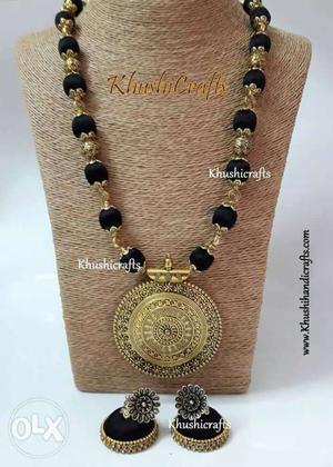Gold-colored Necklace And Rings