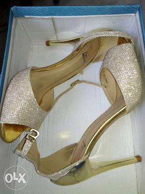 Golden high heels. one time used. 6 months old.