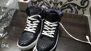 Pair Of Black BUCKAROO High-top Sneakers