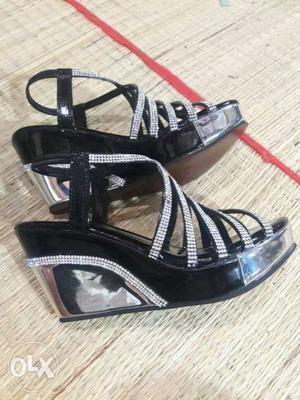 Pair Of Black Leather Open-toe Wedge Sandals