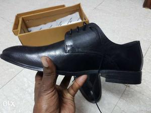 Pair Of Black Leather Shoes