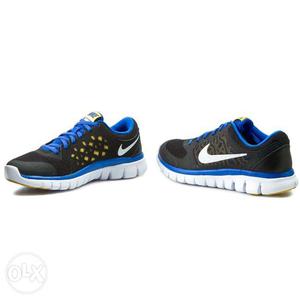 Pair Of Blue-and-white Nike Running Shoes