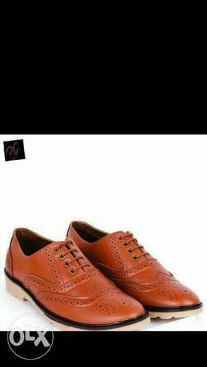 Pair Of Brown Leather Wingtip Shoes