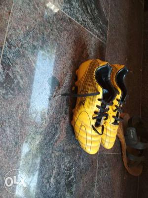 Pair Of Yellow Cleats