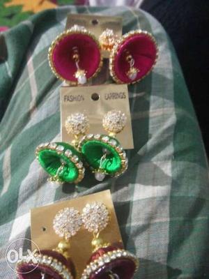 Three Maroon And Green Jhumka Earrings