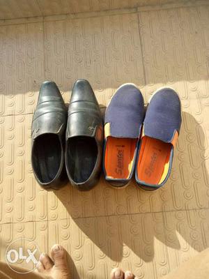 Two Pairs Of Black Leather And Blue Suede Slip-on Shoes