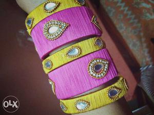 Two Pink And Three Yellow Silk Thread Bangles