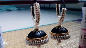 Two black pearl decorated silk thread jumkas