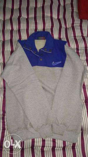 White n Blue and black sweatshirt. Very good condition.