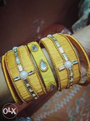 Yellow, Silver, And Gold-colored Silk Thread Bangles