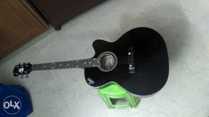 6 Strings Acoustic Guitar for sale with strings.