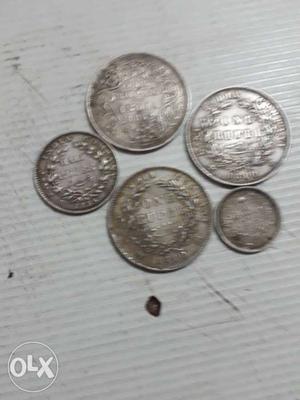 Five Silver-colored Coins