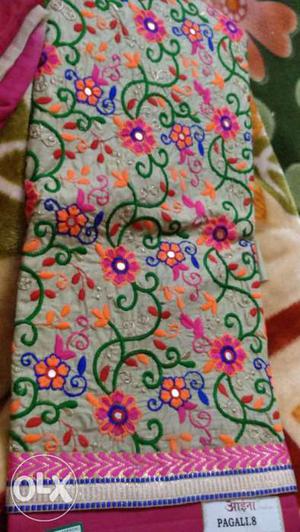 Grey, Pink, Green, And Orange Floral Textile
