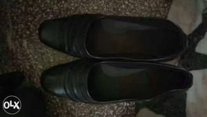 Pair Of Black Leather Flat Shoes