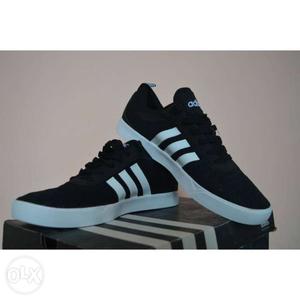 Pair Of Black-and-white Adidas Sneakers