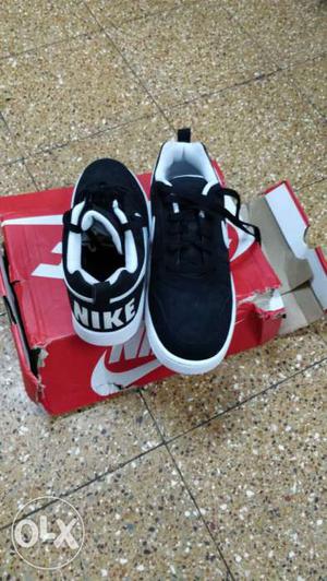 Pair Of Black-and-white Nike Sneakers With Box