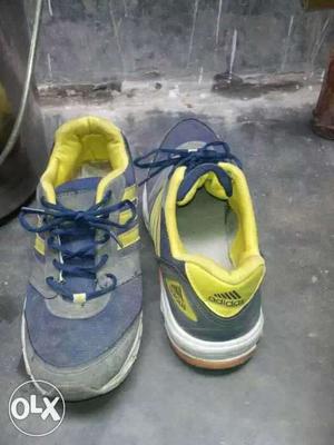 Pair Of Gray-and-yellow Adidas Basketball Shoes