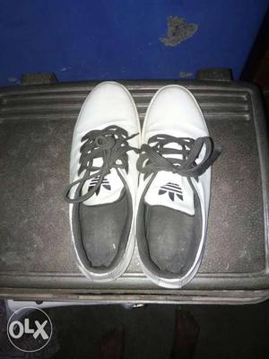 Pair Of White Adidas Sneakers