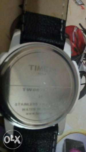 Round Silver-colored Timex Watch With Black Leather Strap