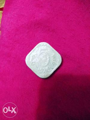 Silver-colored 5 Coin