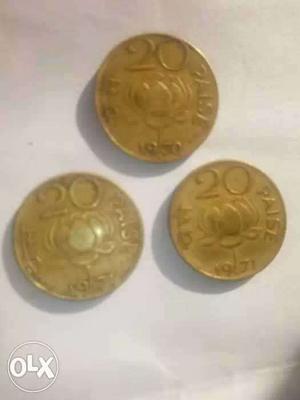 Three Round Gold-colored 20 Indian Paise Coins