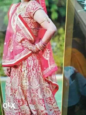 Two time used cherry designer red colour lehnga