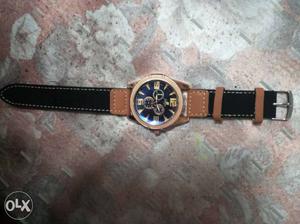 Golden watch with matte leather black strap market price