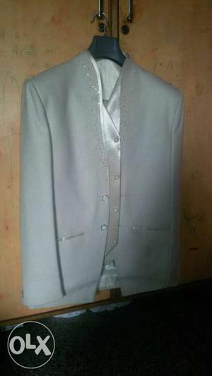 Light cream color new suit for marriage function