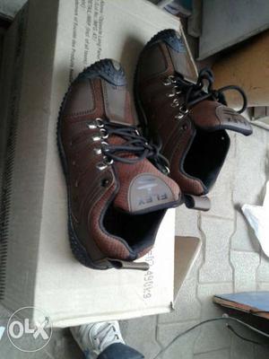 Pair Of Brown And Black Leather Work Shoes