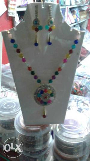 Pink, Blue, And Yellow Beaded Necklace And Earrings