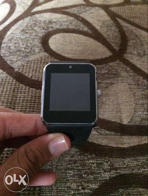 Silver-colored Smart Watch With Black Band
