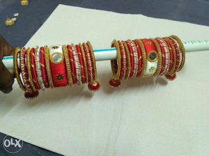 Two Red-and-gold-colored Silk Thread Bangles Set
