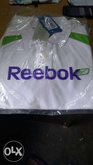 White Reebok Polo Shirt and bags