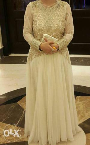 White stylish gown with golden thread n beats work