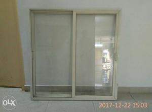 Aluminium sliding window with iron grill, size