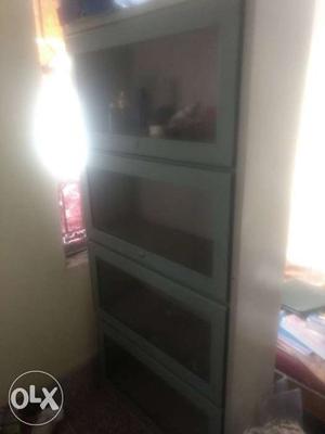 Metal book rack in perfect condition with four