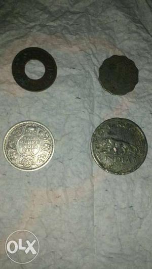 Four British indian coins half rupee  one Anna 