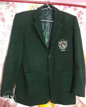 Green colour school blazer.