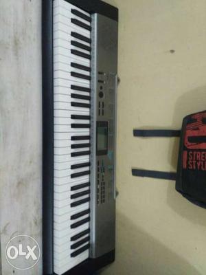 Grey And White Electric Keyboard Piano