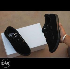 Pair Of Black Velcro Shoes